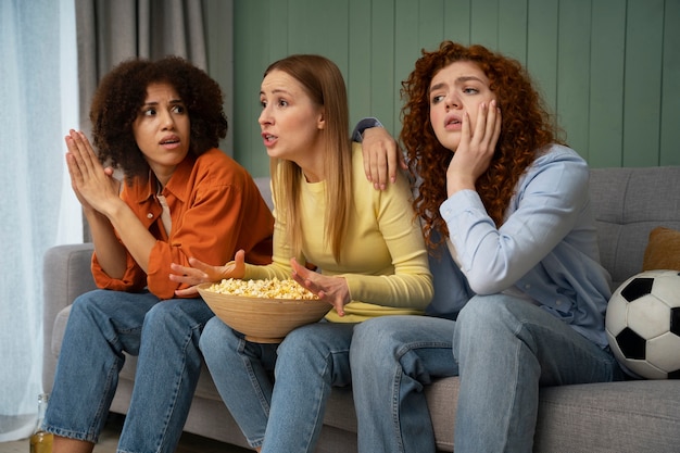 Group of friends watching sports together on IPTV service