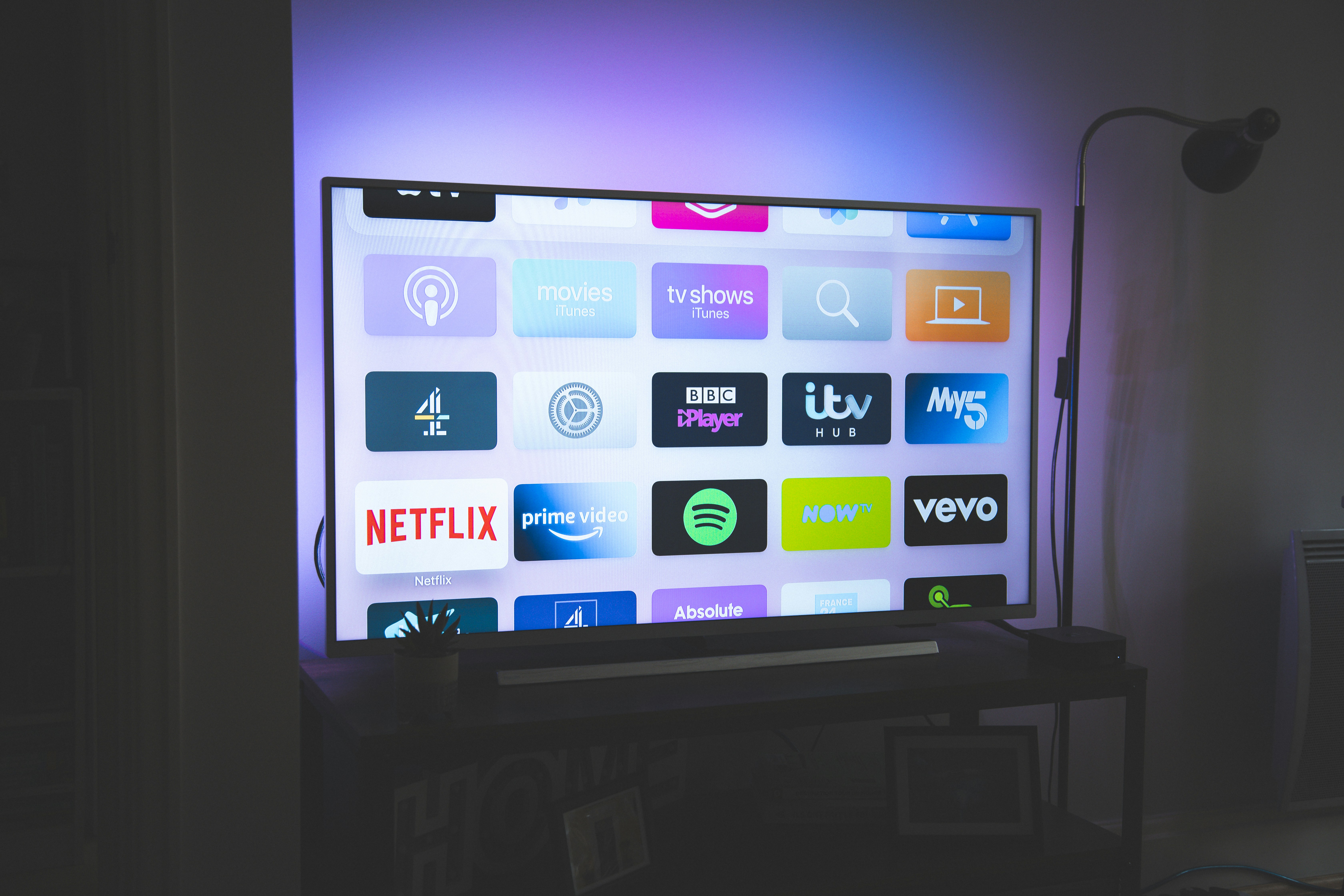 Person enjoying gaming on TV