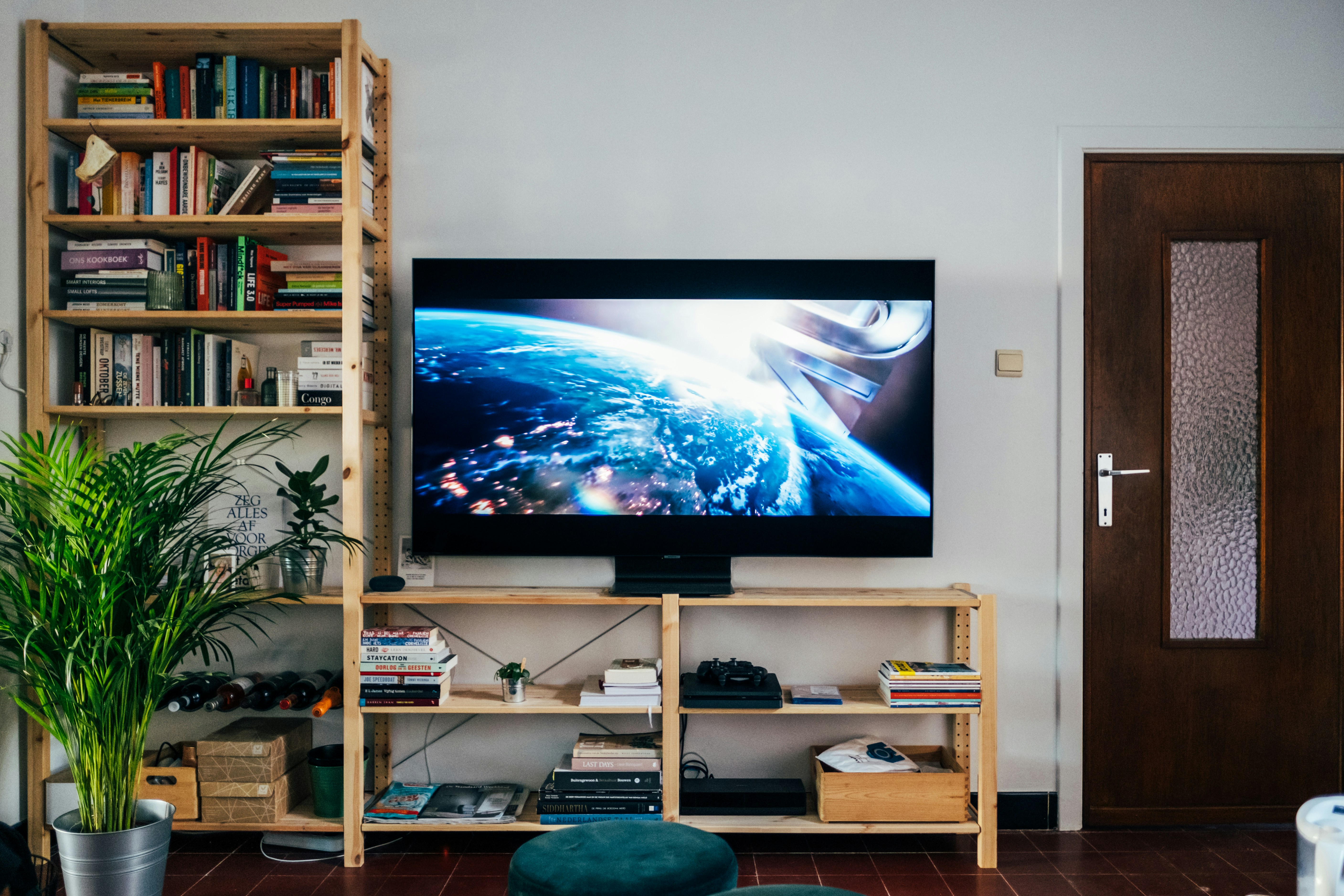 Person enjoying 4K IPTV content on a modern television