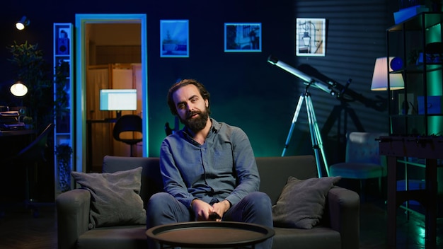 Frustrated sports fan watching match and turning off television